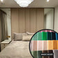 Modern bedroom with beige walls and bed, featuring a close-up of 'Magic Velvet' fabric swatches.