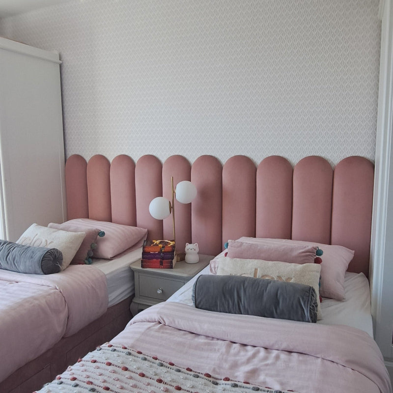 Pink Wall Panels in a room with a bed and nightstand