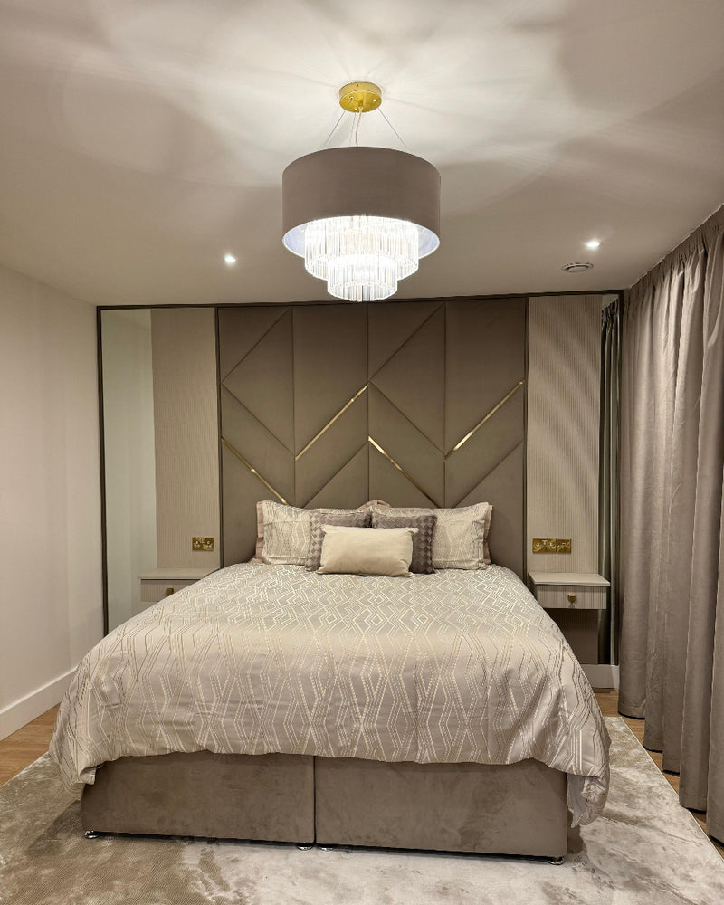 Modern bedroom with geometric headboard and chandelier