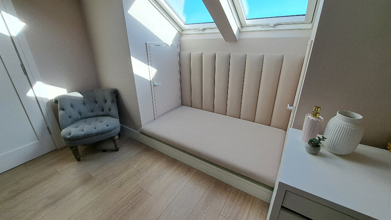 upholstered bench panels under window