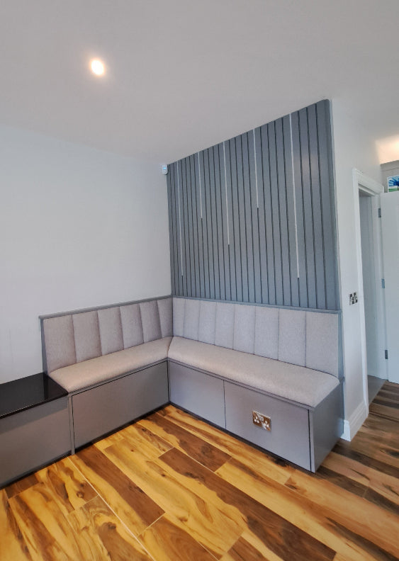 Ceiling with a rectangular wall panels and wooden paneling on the right side.