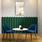 Green round fence wall panels with table and chairs 