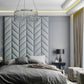 Herringbone wall paneling as headboard