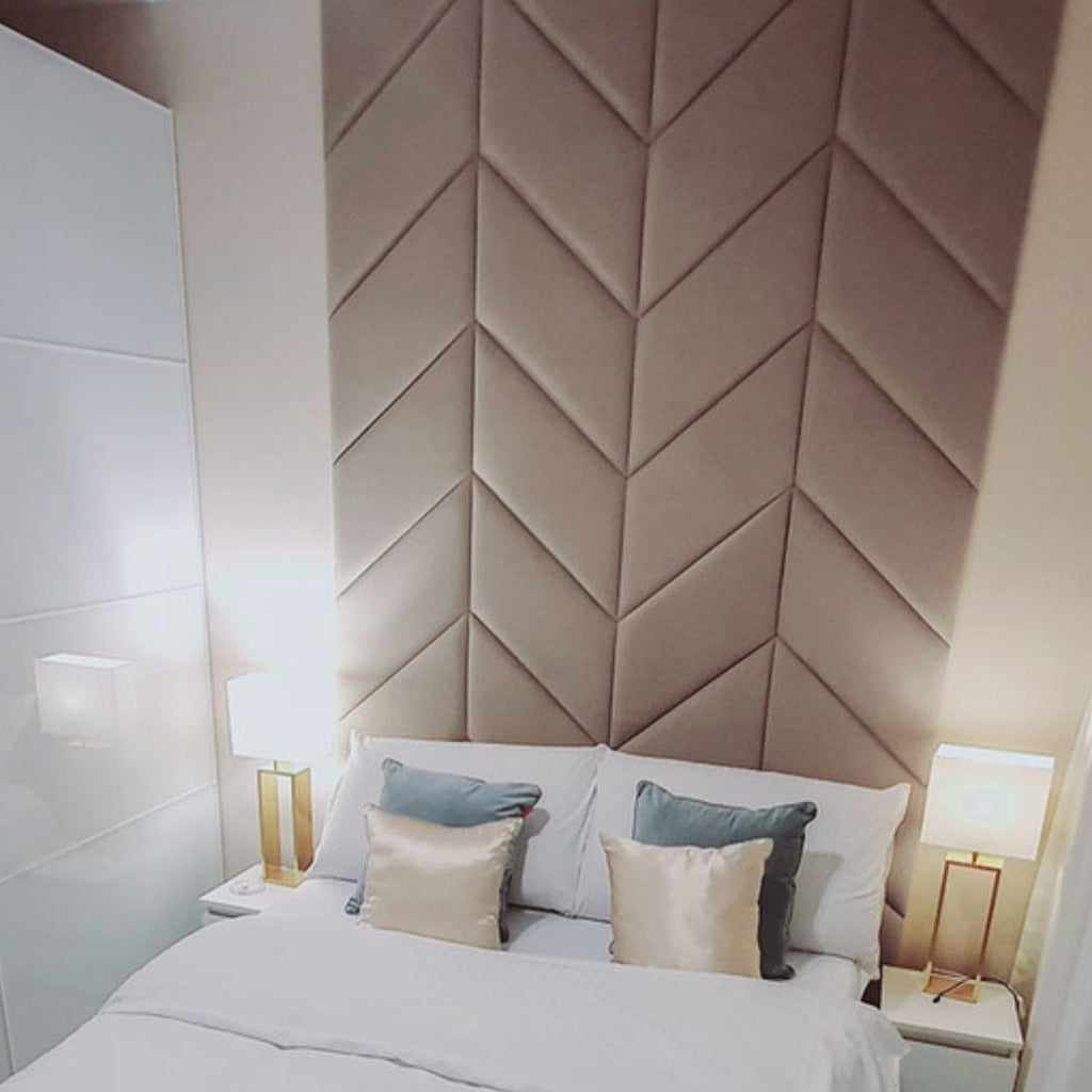 Herringbone wall paneling as headboard