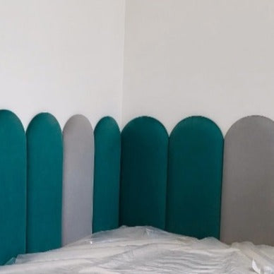 Green and grey round fence wall panels surrounding bed