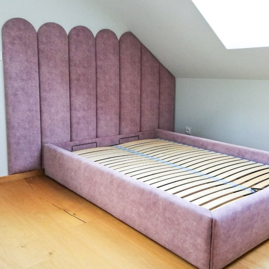 Pink round fence panels as headboard 