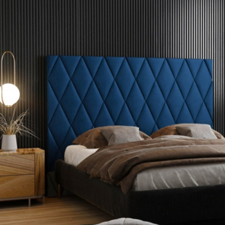 Diamond upholstered wall paneling in bedroom