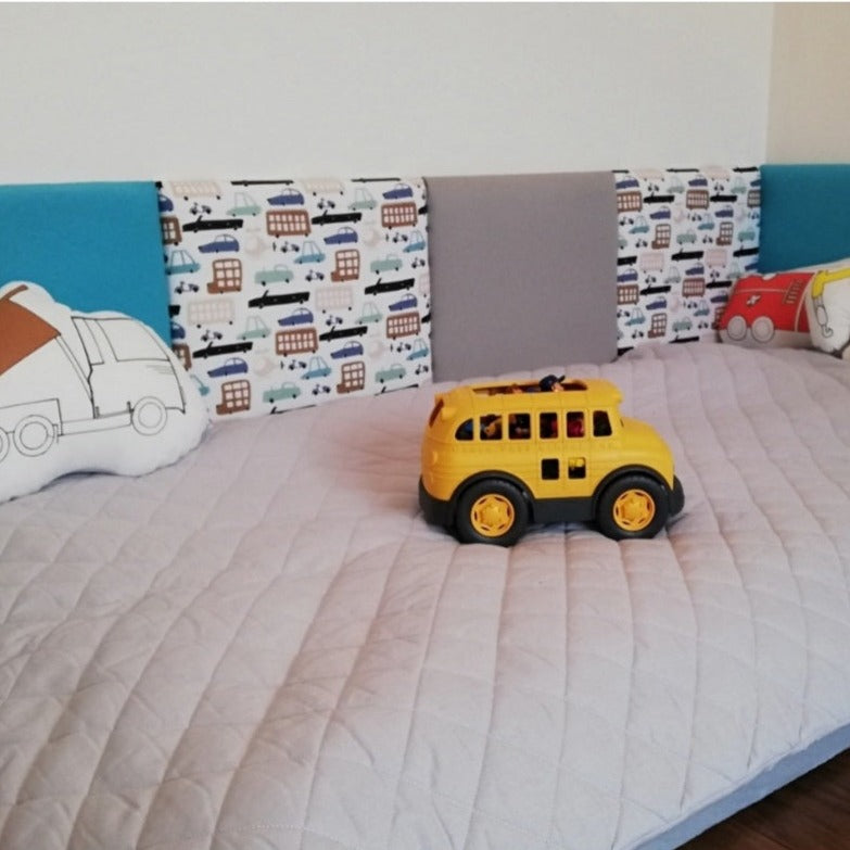 Children's wall panel around bed with car patterns
